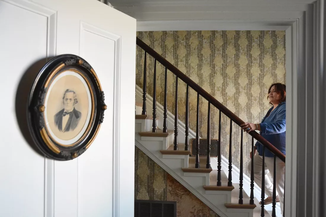 Amy Rowland (6th generation Rowland) and portrait of John A. Rowland I.
House Museum site visit, February 23, 2024. Photograph by Evan Curtis Charles Hall.